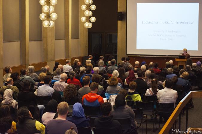 Professor McAuliffe introducing her presentation in front of a full room of guests